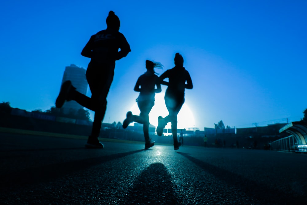 Two runners training together at first light.